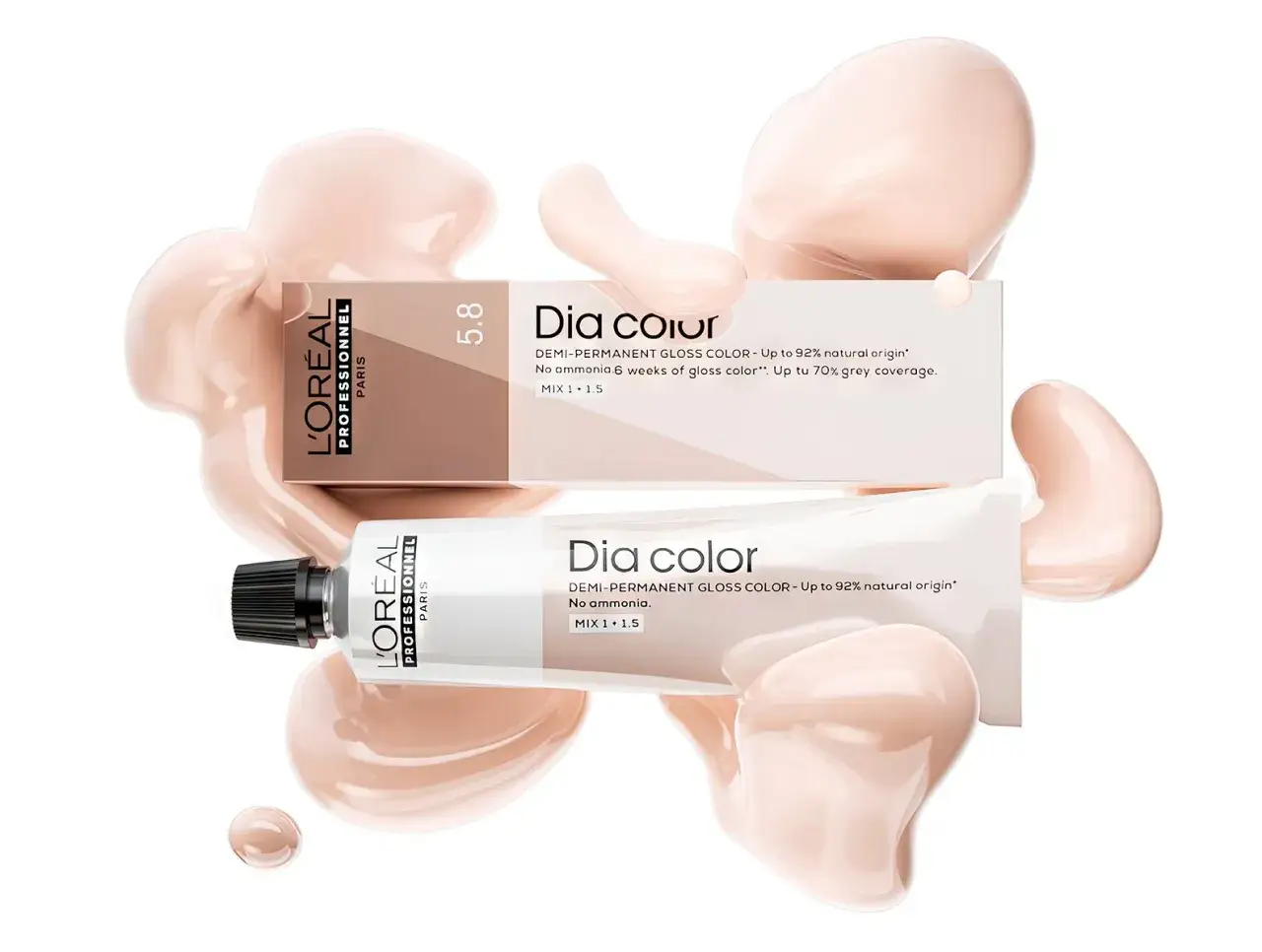 Tubos y caja de tinte L'Oréal Professionnel Dia Color, con gotas de producto que realzan la pigmentación del cabello.