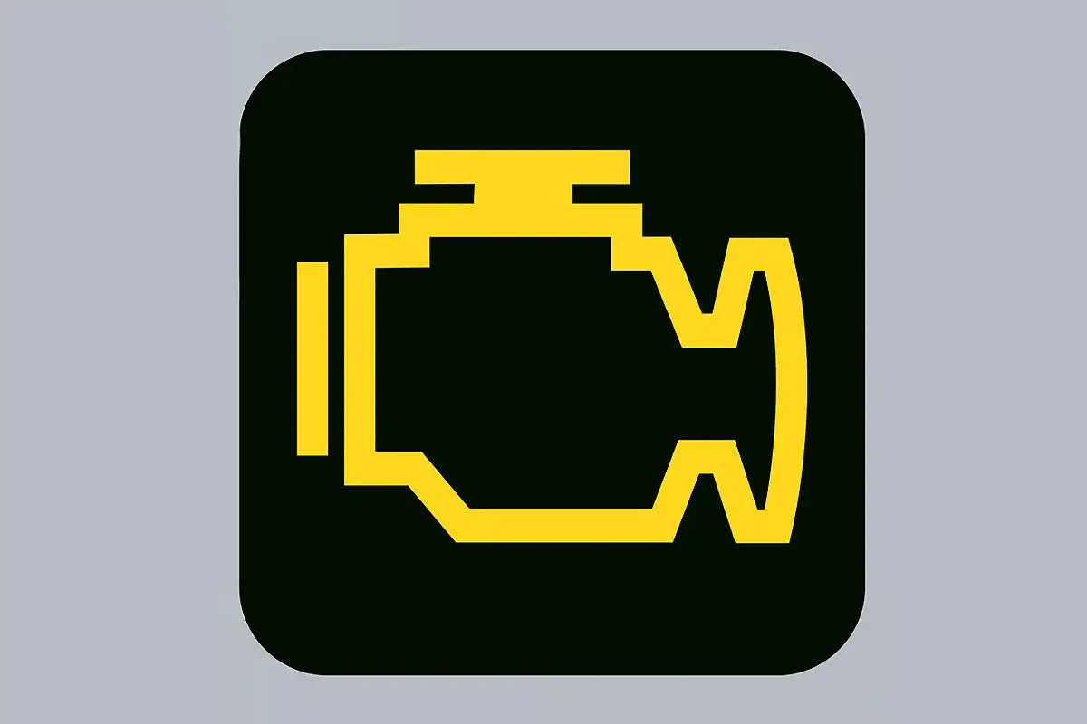 Gelbes Symbol eines Motors auf schwarzem Grund. So sieht die Motorkontrollleuchte aus, wenn etwas mit dem Antrieb nicht stimmt.