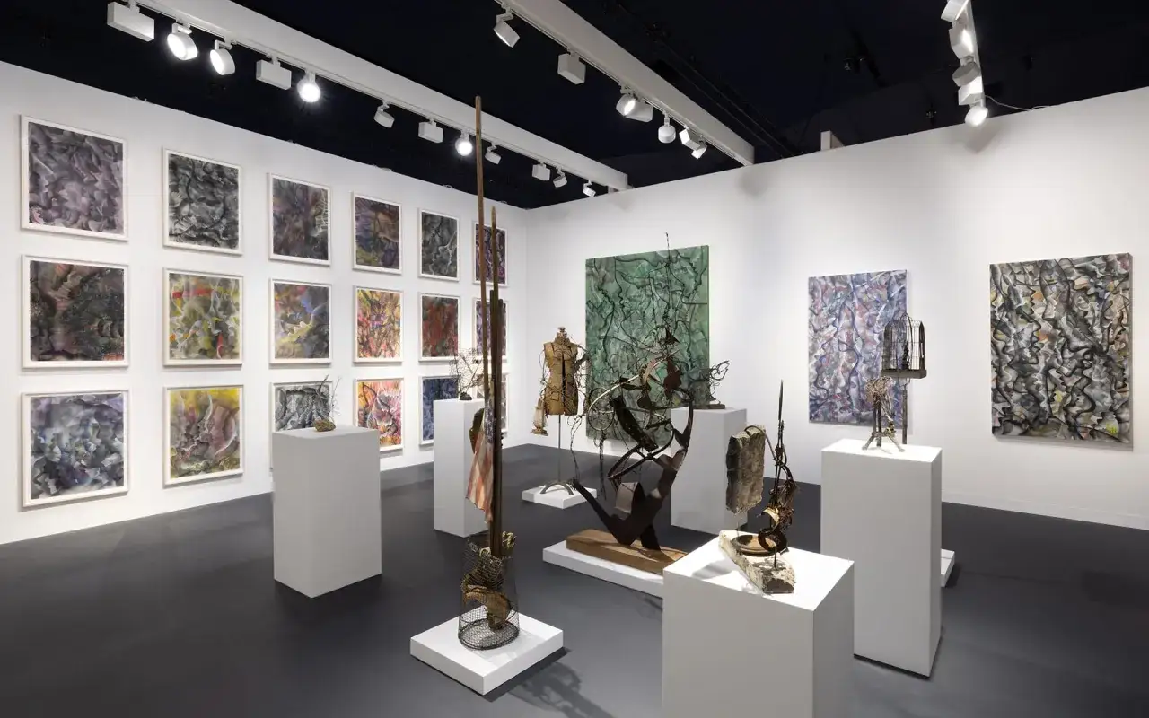 Gallery exhibition featuring abstract paintings and sculptures. Discover the best way to invest in art by exploring diverse contemporary pieces.