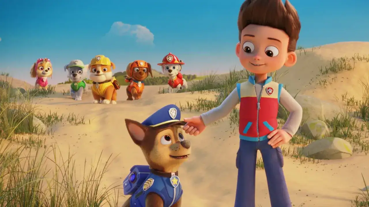 Ryder streichelt Chase, w&auml;hrend die anderen Welpen im Hintergrund von 
