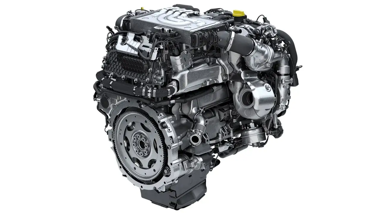 Motore Ingenium, un capolavoro di ingegneria automobilistica, mostra la sua complessa struttura con turbocompressore e volano.