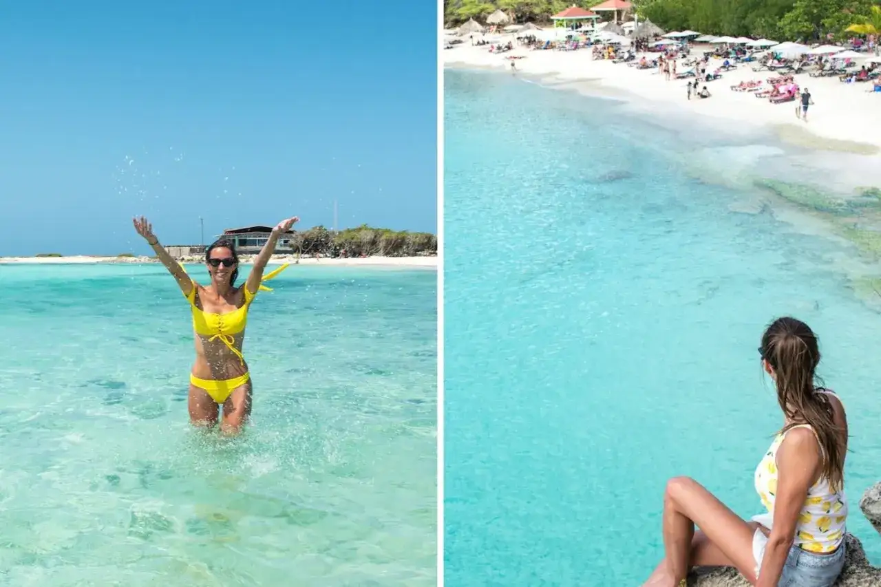 Frau im gelben Bikini planscht im türkisfarbenen Wasser, im Hintergrund eine belebte Bucht. Ein Traumurlaub auf Aruba oder Curacao.