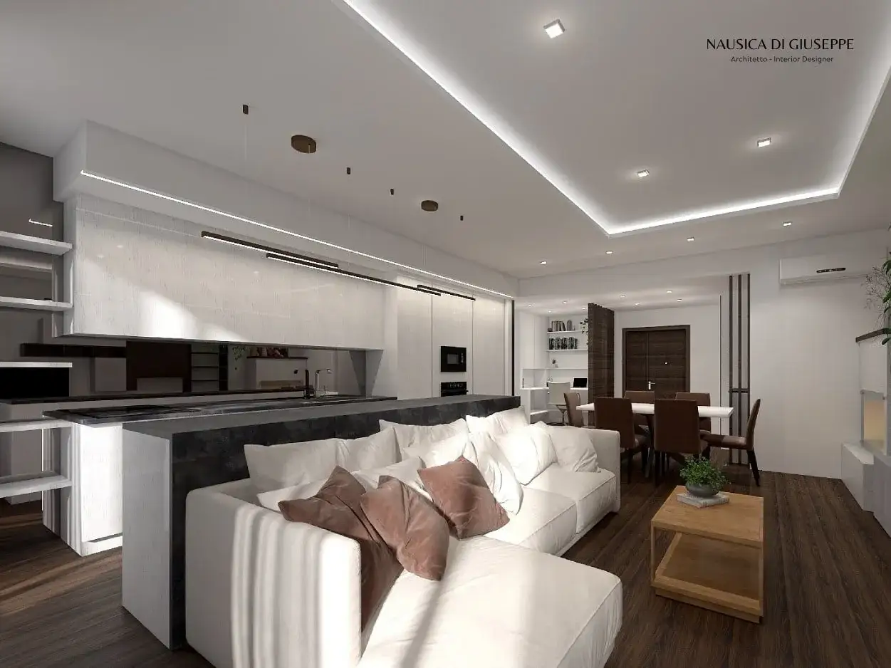 Illuminazione moderna con faretti incassati nel controsoffitto in cartongesso, che valorizzano la cucina e il soggiorno.