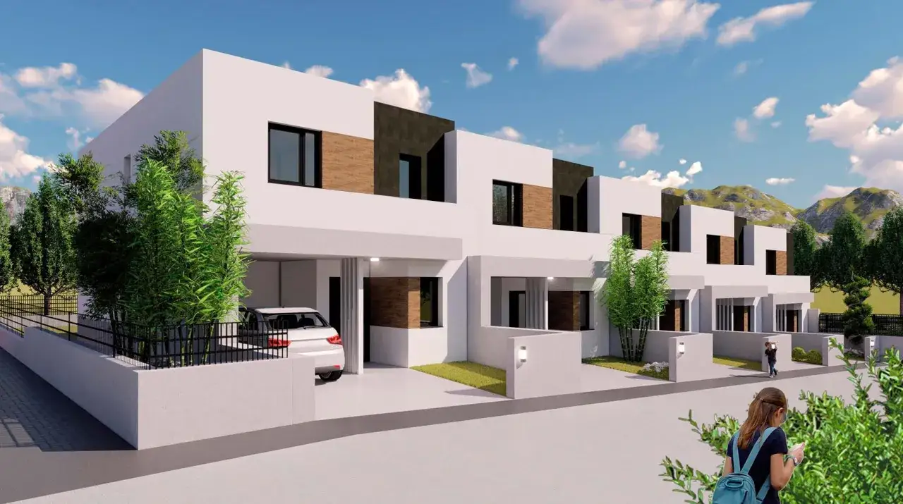 Modernos chalets adosados con diseño minimalista, fachadas blancas y detalles en madera. Un coche blanco aparcado en uno de ellos.
