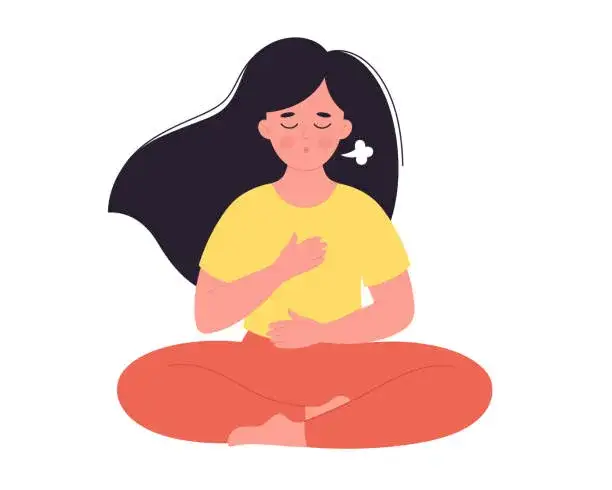 kobieta medytująca, ćwiczenia oddechowe, mindfulness