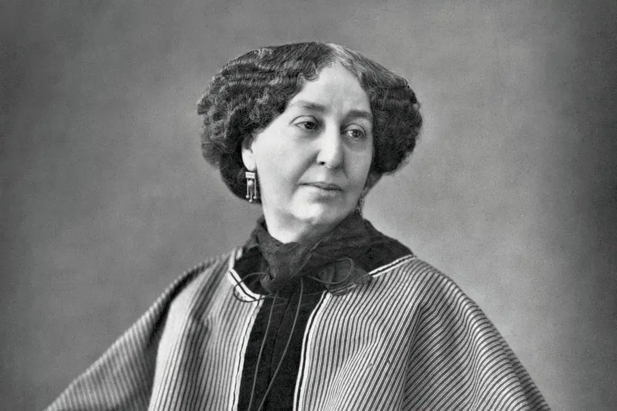 Portret George Sand, pisarki znanej z wielu ciekawostek. Widać jej charakterystyczną fryzurę i strój.