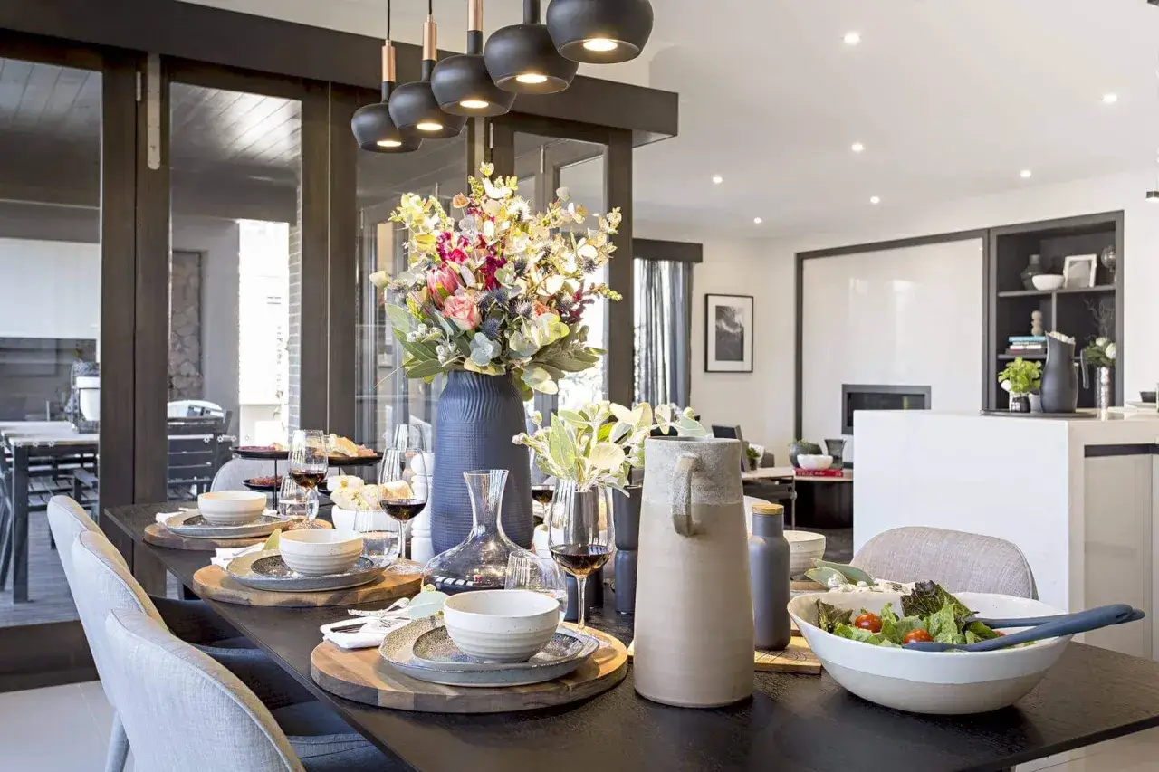 A beautifully set dining table with elegant chairs, perfect for inspiration on how to choose dining chairs that complement your style.