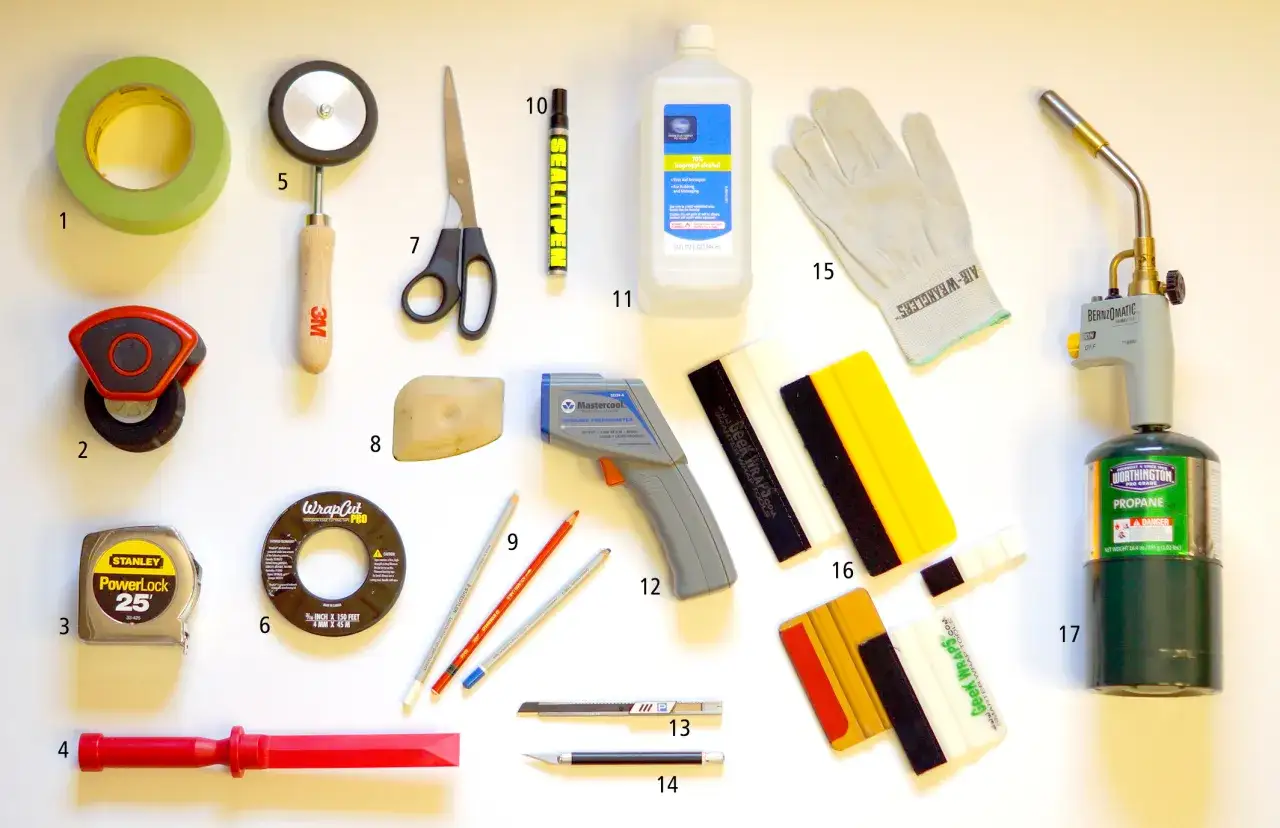 Tools you need to wrap a car: tape, squeegees, knife, tape measure, cutting tape, marker, alcohol, gloves, thermometer, and a propane torch.