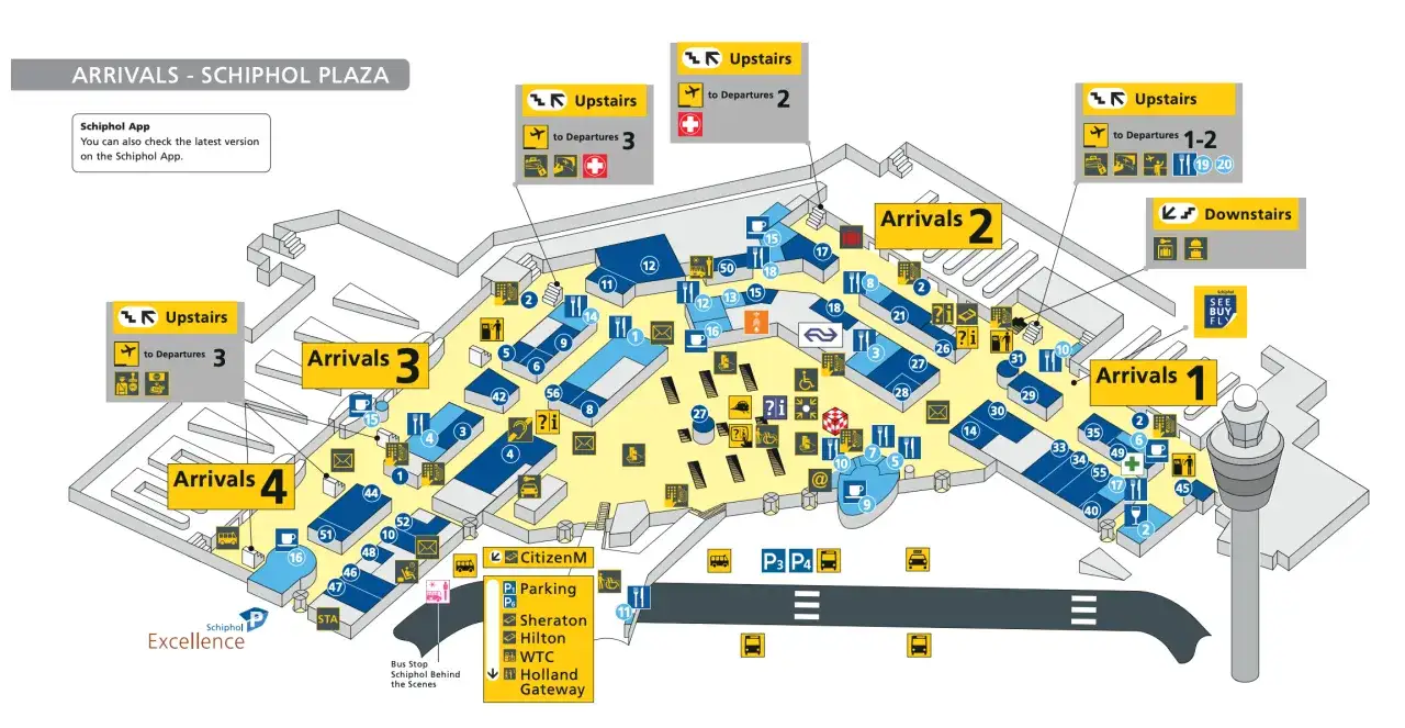 Mapa lotniska Schiphol Plaza z oznaczeniami stref przylotów i odlotów.