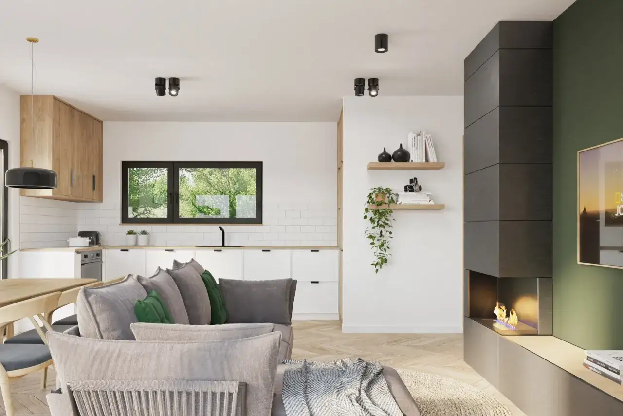 Przytulny salon z aneksem kuchennym, idealny do małego domu do 70m2. Kominek i wygodna sofa tworzą serce tego nowoczesnego wnętrza.
