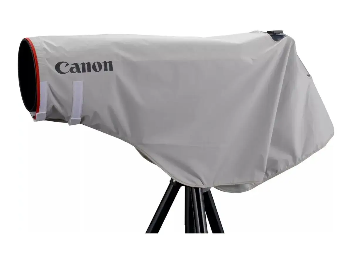 A Canon camera with a lens is covered by a light gray rain cover, offering weather sealing for your gear.
