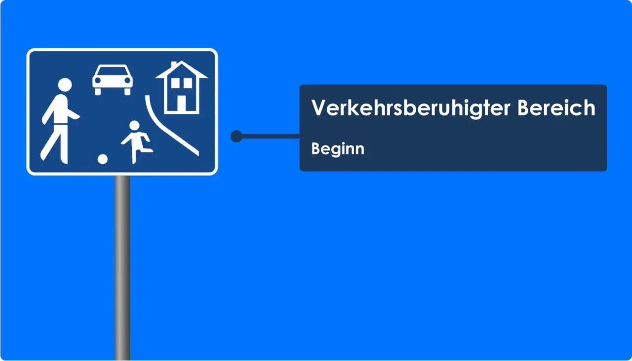 Verkehrsberuhigter Bereich: Hier gilt Schrittgeschwindigkeit. Das Schild zeigt Fu&szlig;g&auml;nger, spielende Kinder, ein Auto und ein Haus.