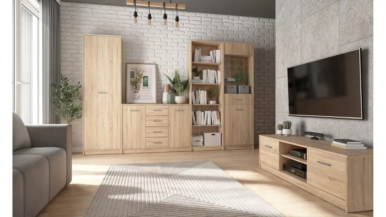 Nowoczesny salon z meblościanką szafa nepo plus, szarą sofą i telewizorem na ścianie.