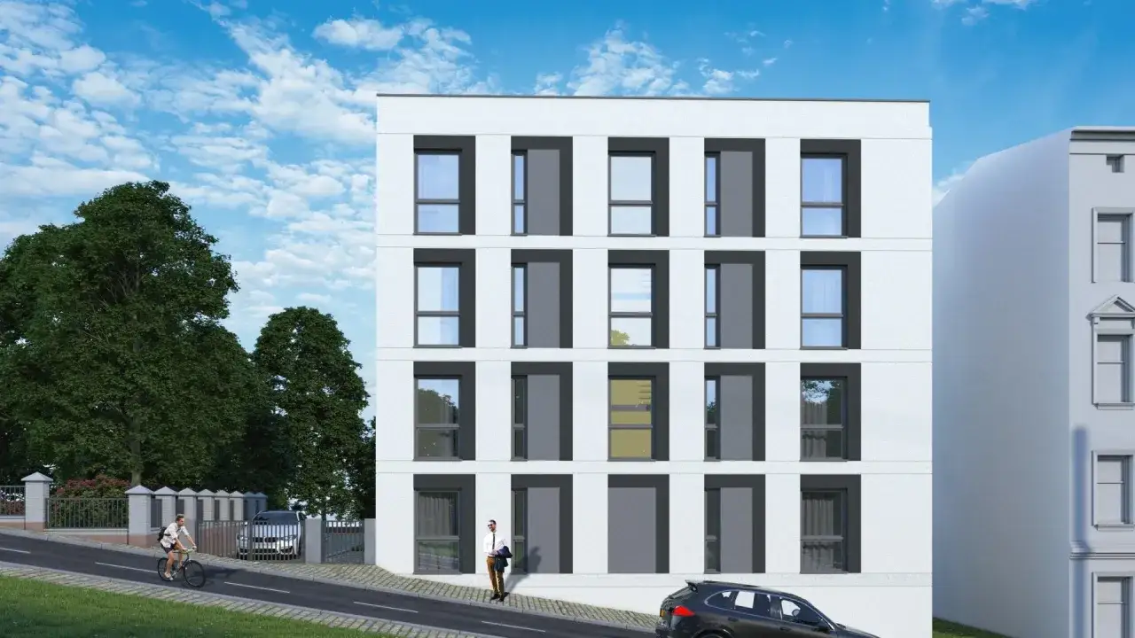 Nowe inwestycje Szczecin: nowoczesny budynek mieszkalny z dużymi oknami, obok drzew i ulicy z rowerzystą.