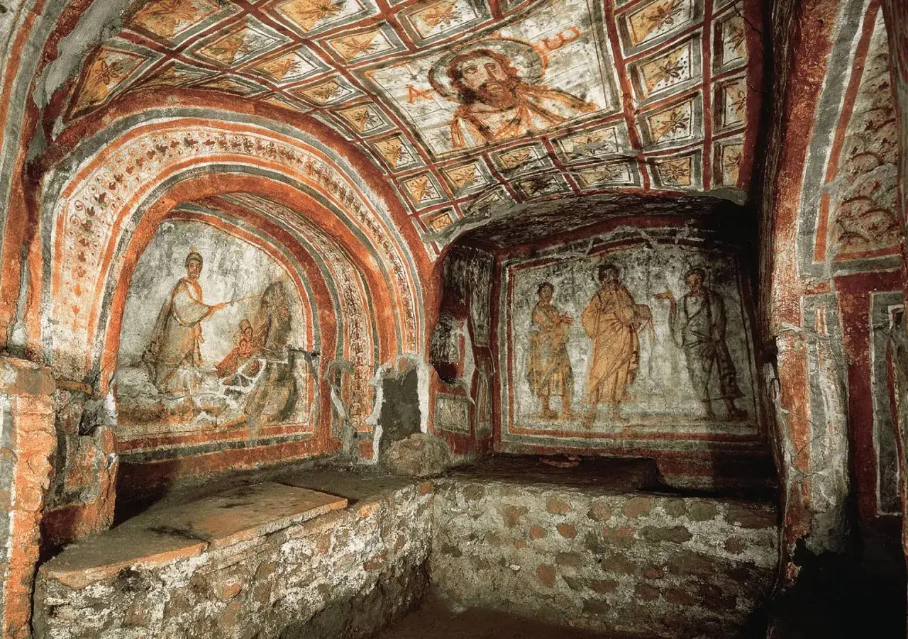 Ancient frescoes in a catacomb depict biblical scenes, hinting at why church on Sunday became a tradition.