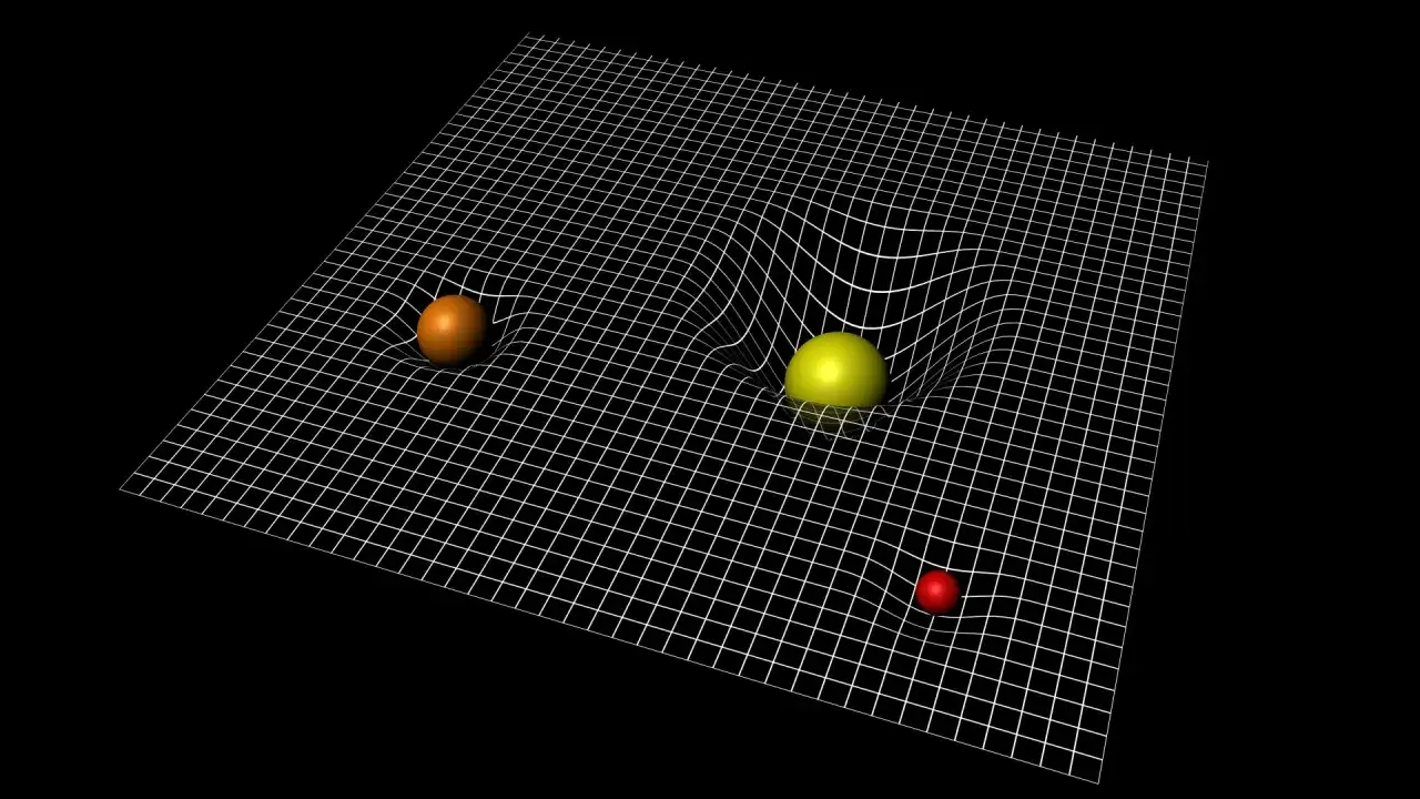 Visualisering av Einsteins teori om gravitation. Kulor p&aring; ett rutn&auml;t som b&ouml;js av deras massa, likt hur massiva objekt b&ouml;jer rumtiden.