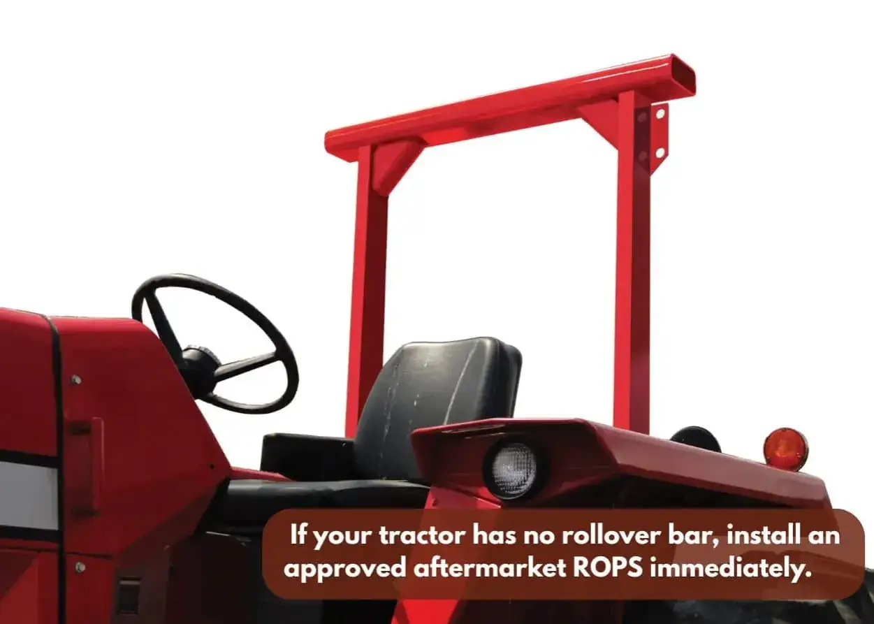 Red tractor cab with a steering wheel and seat. A red rollover protection structure (ROPS) is installed, highlighting machine safety tips.