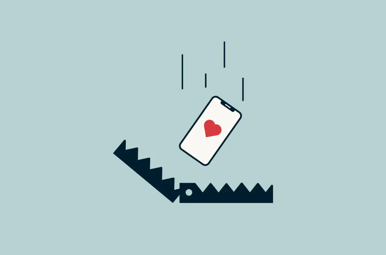 Telefon z sercem spada w pułapkę. To symbol rzeczy, o których kłamiemy na portalach randkowych, by zdobyć czyjeś serce.
