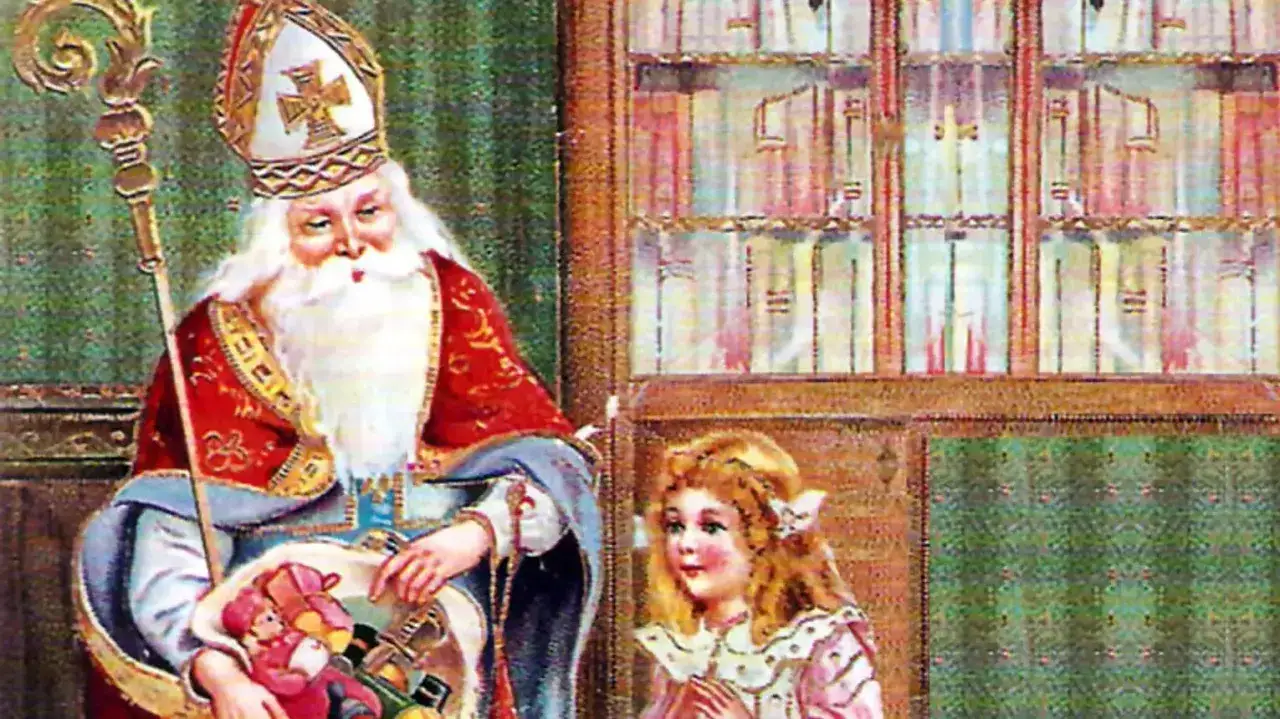 Święty Mikołaj z koszem pełnym zabawek, obok niego mała dziewczynka. Czas na prezenty, kiedy przychodzi święty mikołaj!