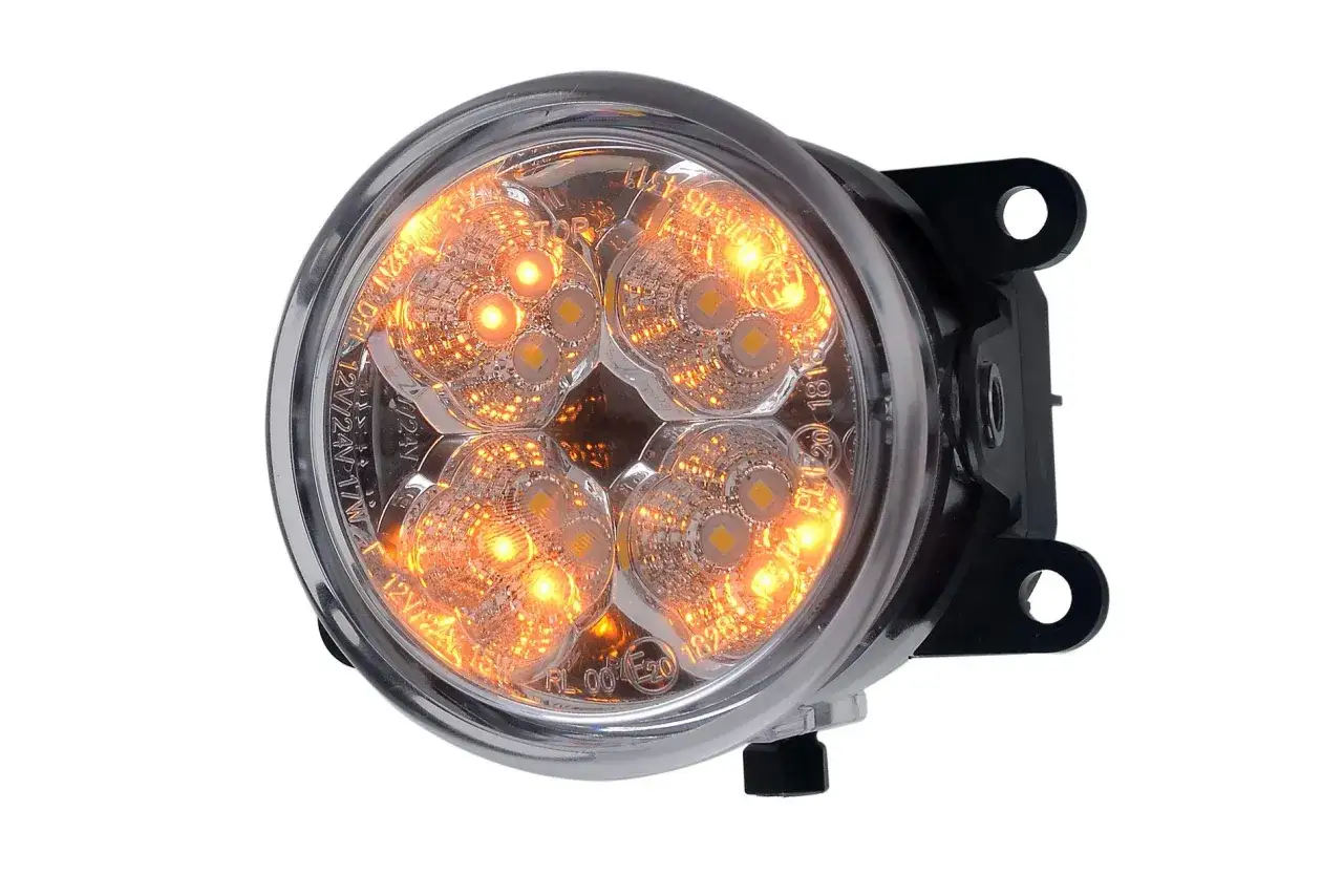 Un feu de jour rond à LED orange vif, avec un support noir.