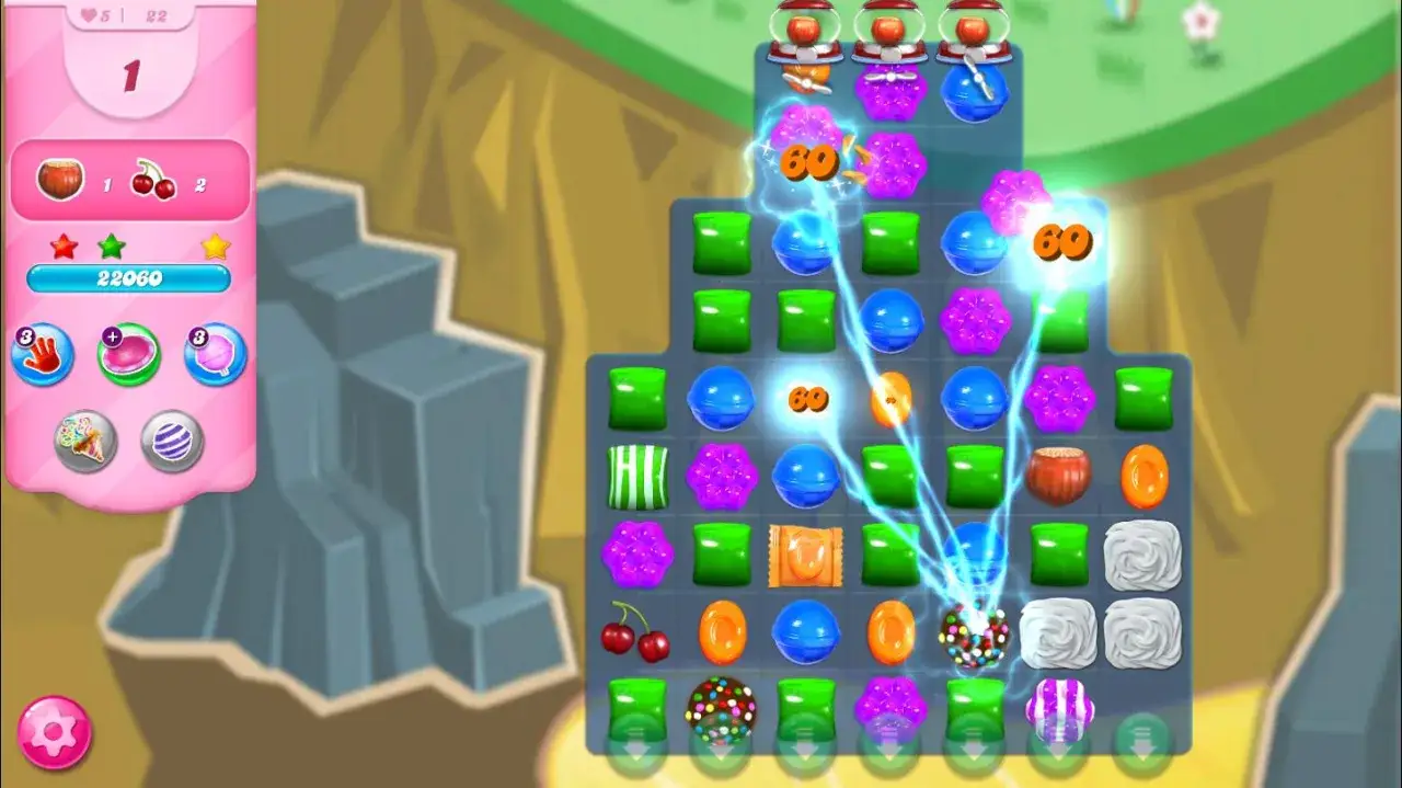 Gra Candy Crush Saga, poziom 1. Widać kolorowe cukierki i efekty specjalne. Szukasz candy crush saga kody?