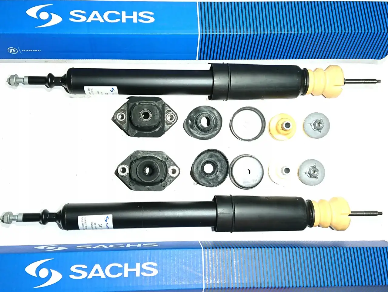Dwa amortyzatory Sachs i akcesoria, idealne jako amortyzatory do BMW E90 tył.