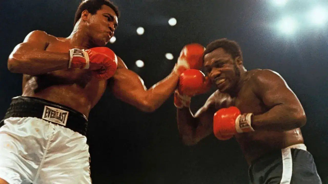 Muhammad Ali lands a punch during a pivotal moment in his boxing career, showcasing the intensity of his life events in the ring.