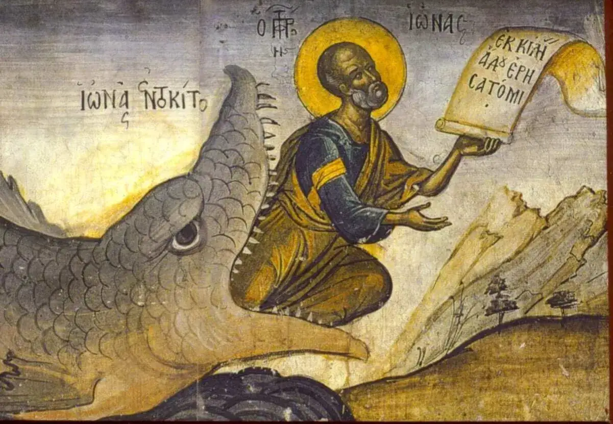 The sign of Jonah: a prophet emerges from a sea monster, holding a scroll.