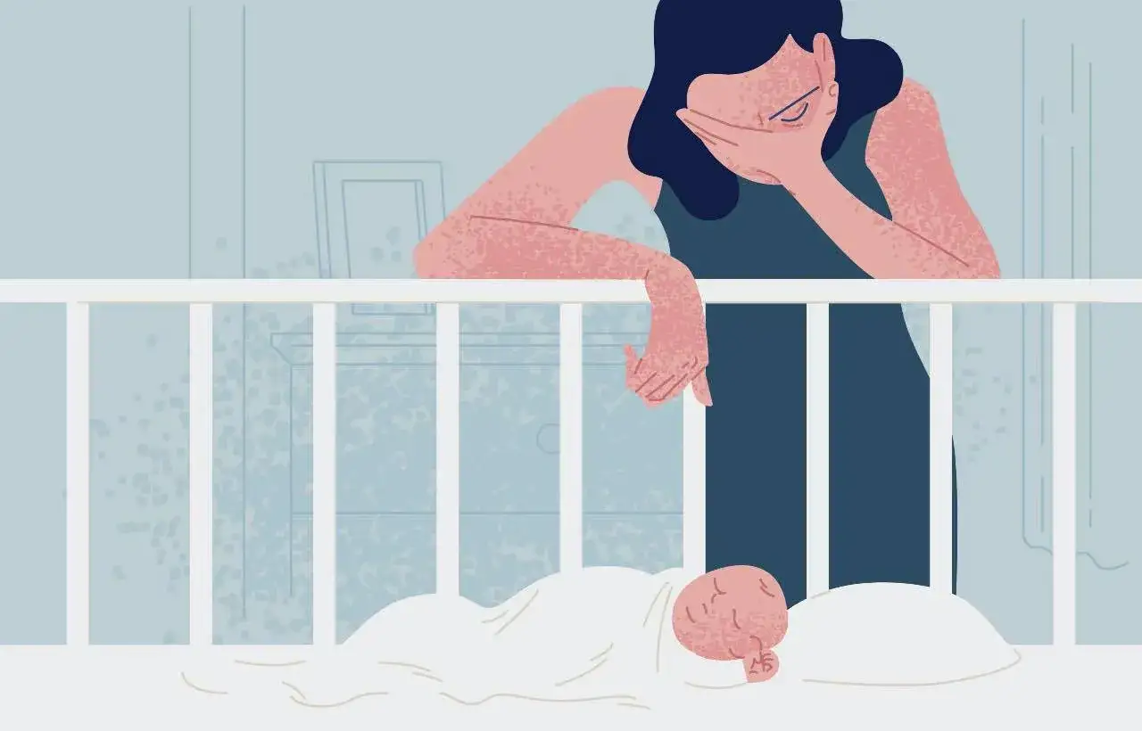 Mamma esausta china sulla culla, coperta dal peso del burnout. Come uscirne? Un grido silenzioso.