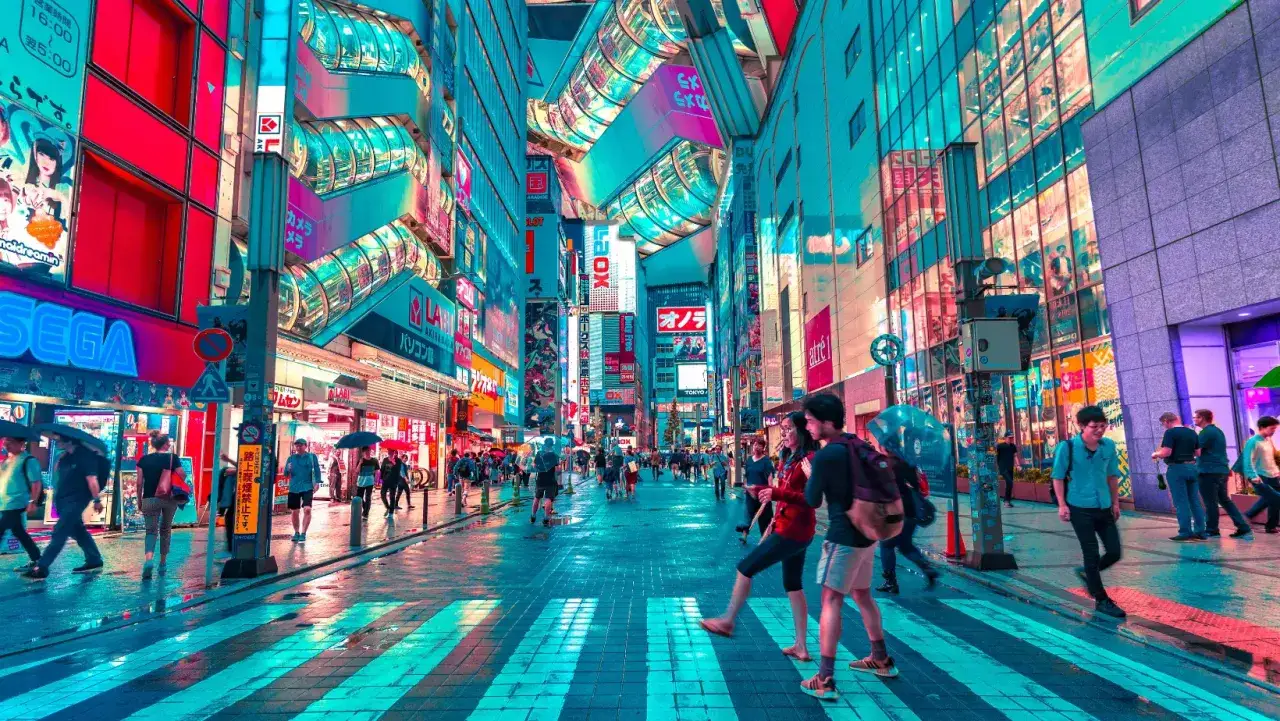 A vibrant street scene in Akihabara, Tokyo, perfect for gay travel in Asia. Neon signs and futuristic architecture create a dazzling atmosphere.
