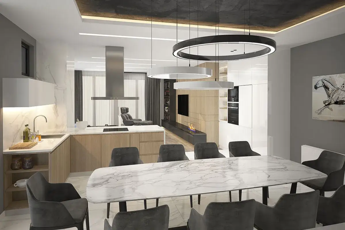 Elegante abbinamento lampadari open space: cucina moderna, zona pranzo con tavolo in marmo e soggiorno con camino.