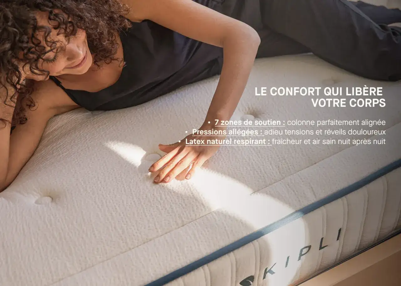 Une femme se repose sur un matelas, profitant du confort du latex naturel respirant. Ce matériau offre un soutien optimal et une fraîcheur incomparable.