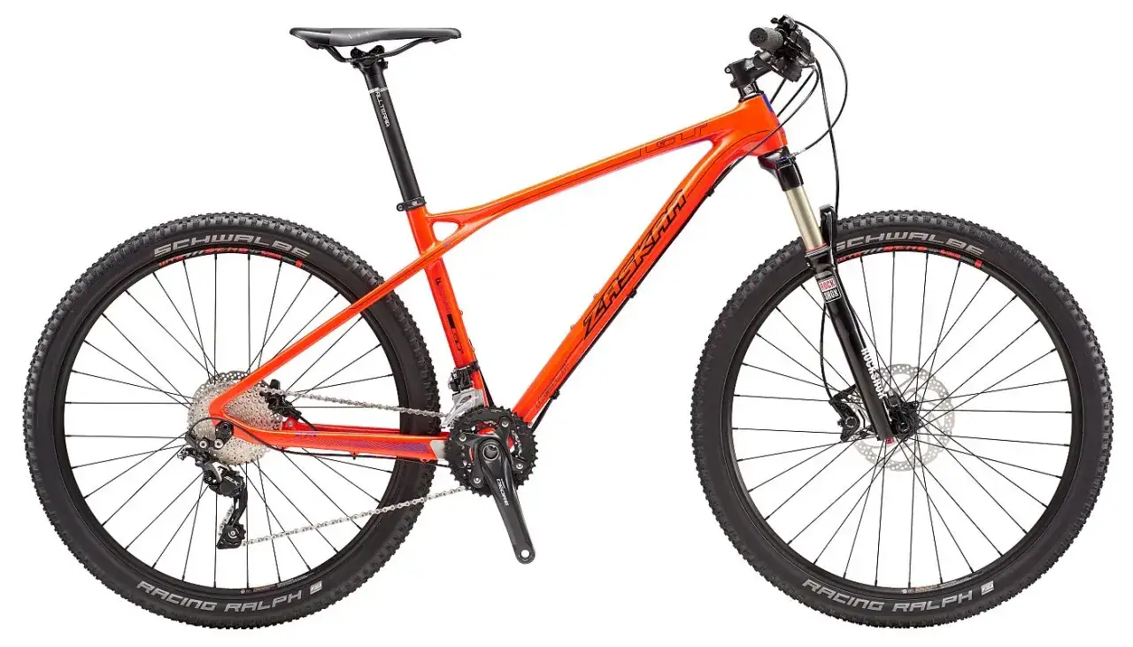 An orange GT Zaskar Carbon mountain bike with Schwalbe Racing Ralph tires and RockShox suspension.