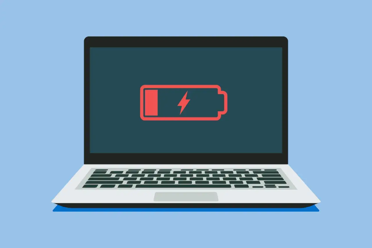 Laptop z ikoną niskiego poziomu baterii. Dowiedz się, jak sprawdzić stan baterii w laptopie, gdy widzisz taki komunikat.