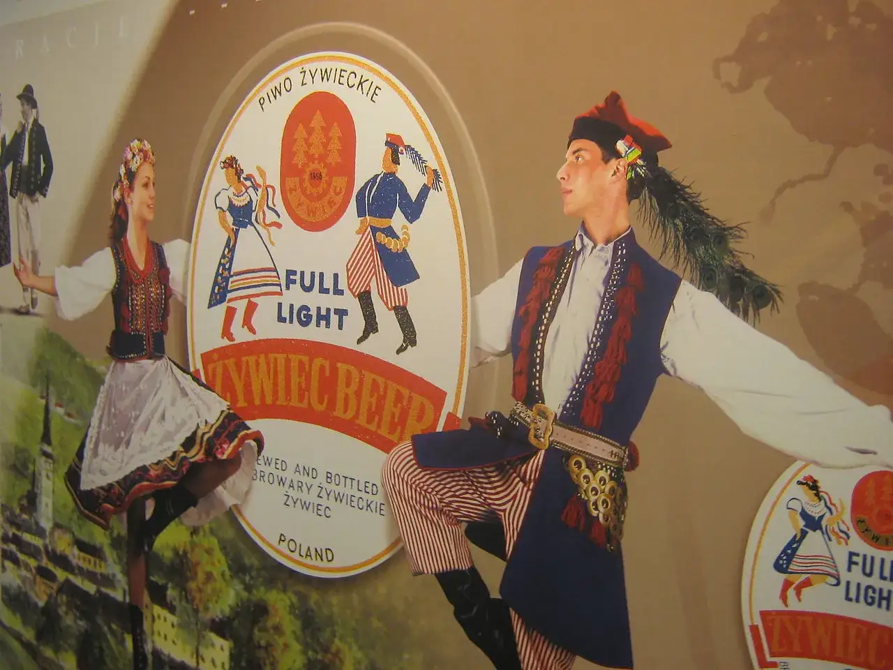 Tancerze w strojach ludowych, symbolizujący **prawdę Żywiec**. W tle logo piwa Żywiec.