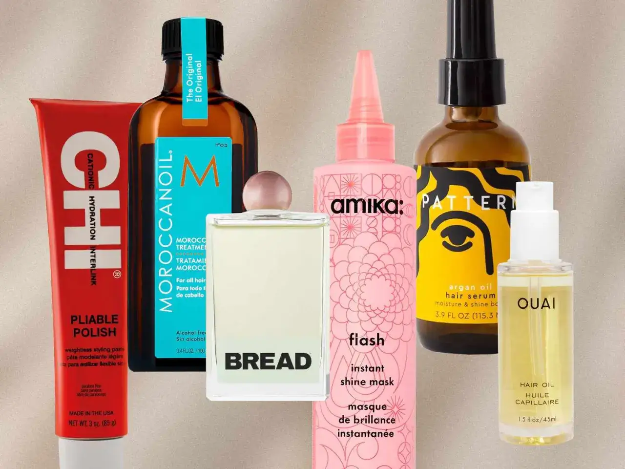 En samling hårprodukter, inklusive en flaska Moroccanoil och en flaska med arganolja för glans.