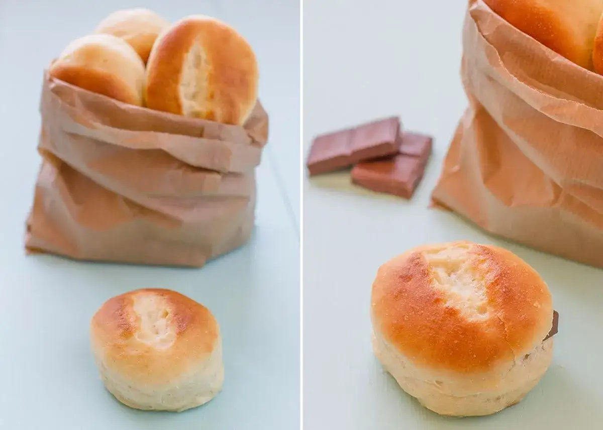 Pan de leche reci&eacute;n horneado en una bolsa de papel, listo para rellenar con chocolate.