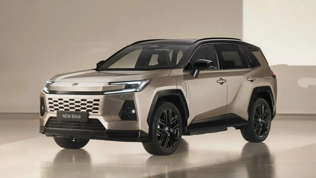 Nowy, złoty Toyota RAV4 SUV z czarnym dachem i felgami, prezentujący nowoczesny design.