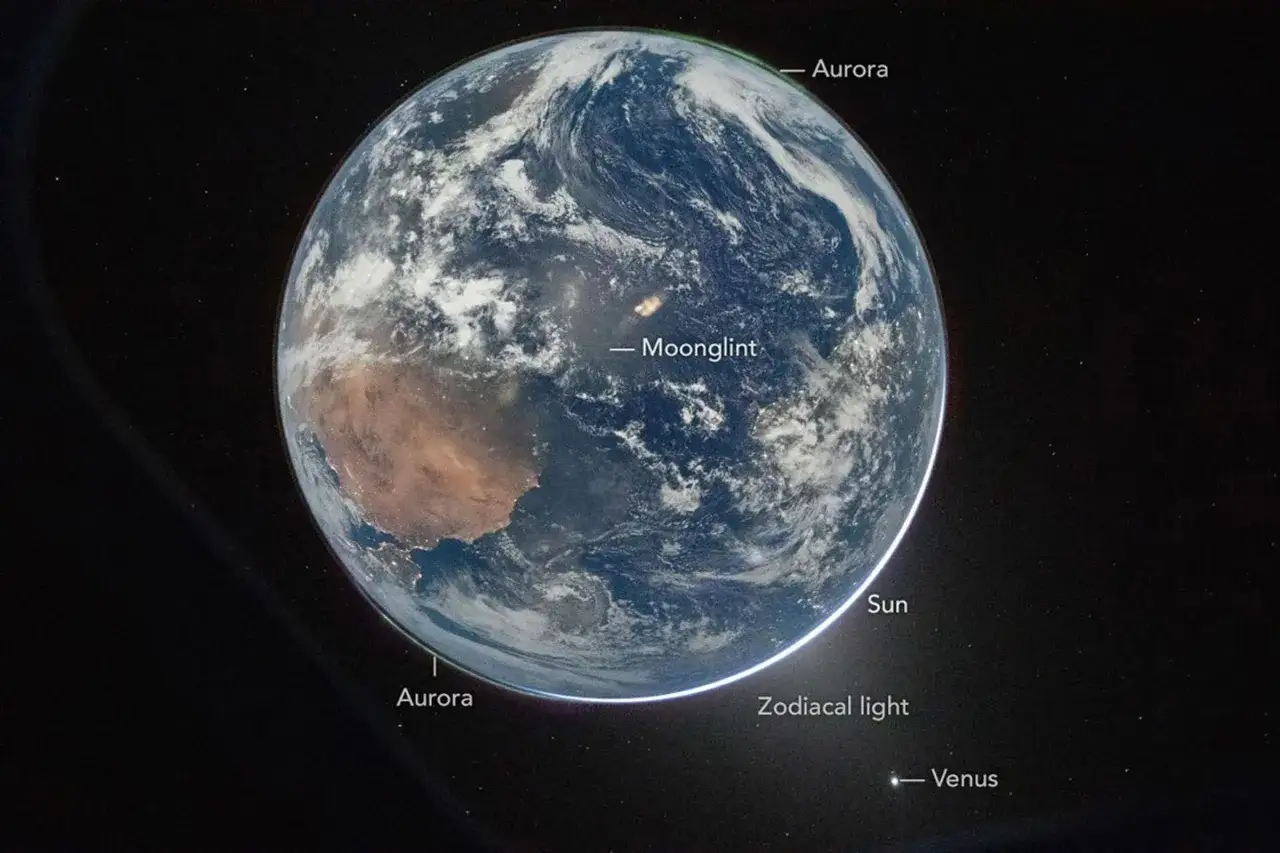 Ziemia widziana z kosmosu, z widocznymi zorzami polarnymi, poświatą księżycową, światłem zodiakalnym i Wenus. Niesamowite zdjecia z kosmosu.