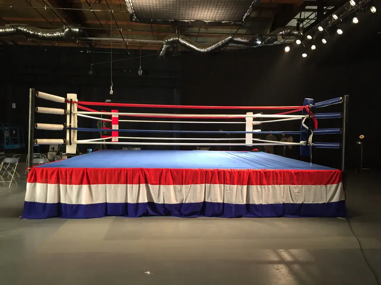 Empty boxing ring, ready for training. Sparring offers immense benefits for fighters, honing skills and building resilience.