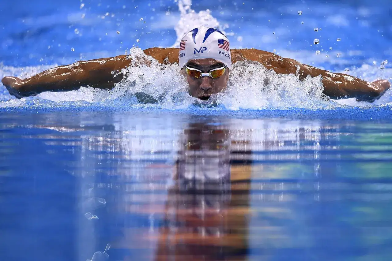 Michael Phelps powers through the water, a blur of motion. While he didn't invent the butterfly stroke, he certainly perfected it.
