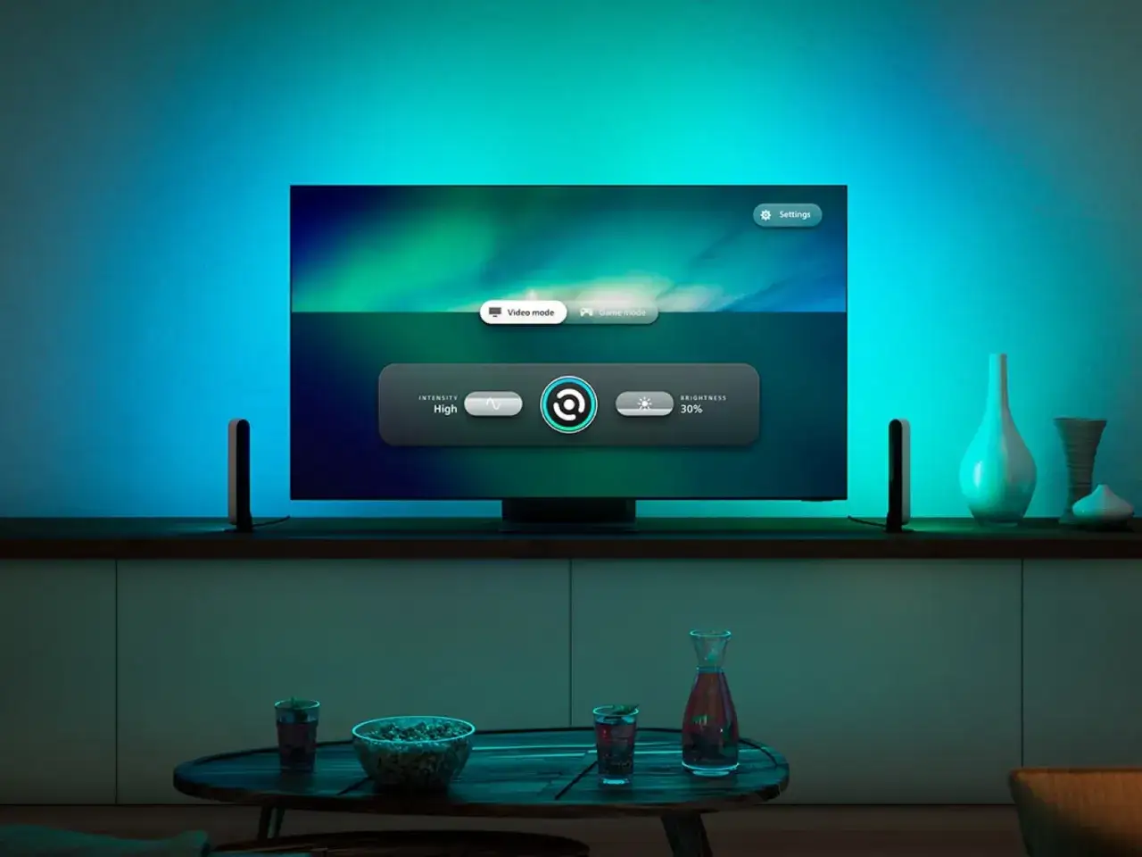 TV-Bildschirm mit der hue sync tv app, die Video- und Spielmodi anzeigt. Intensität auf
