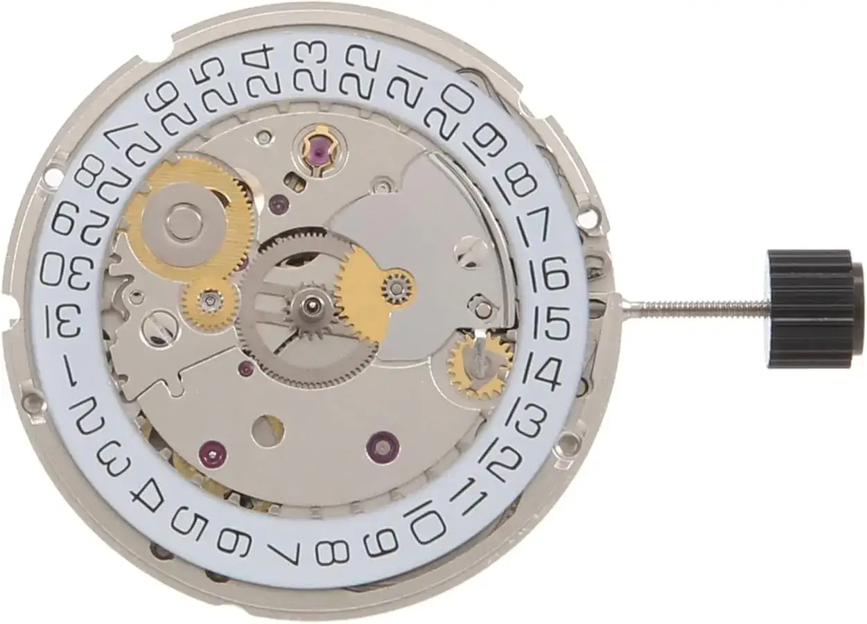 Meccanismo di orologio ETA 2824 con disco data. Ingranaggi dorati e rubini visibili.