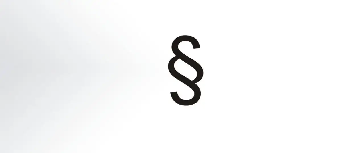Czarny paragraf symbol na jasnym tle.
