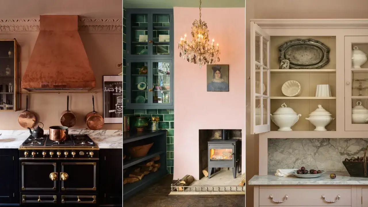 A granny chic kitchen with a copper hood, dark range, green tiled cabinets, pink walls, and a display cabinet filled with white serving dishes.