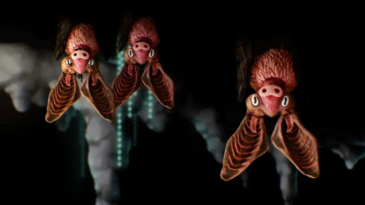Tre pipistrelli dall'aspetto buffo, realizzati in animazione stop motion, pendono a testa in giù in una grotta.