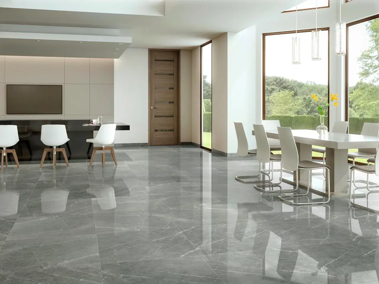 Pavimento lucido effetto marmo in un moderno open space con cucina e sala da pranzo. Riflessi eleganti, ma attenzione ai graffi.