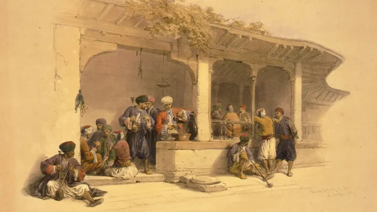 Uomini in abiti tradizionali si riuniscono sotto un portico, forse discutendo di chi ha inventato il caff&egrave;, mentre uno serve bevande.
