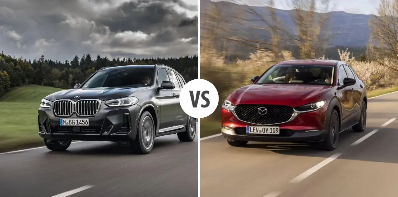 Porównanie BMW X3 i czerwonej Mazdy CX-30 na drodze.