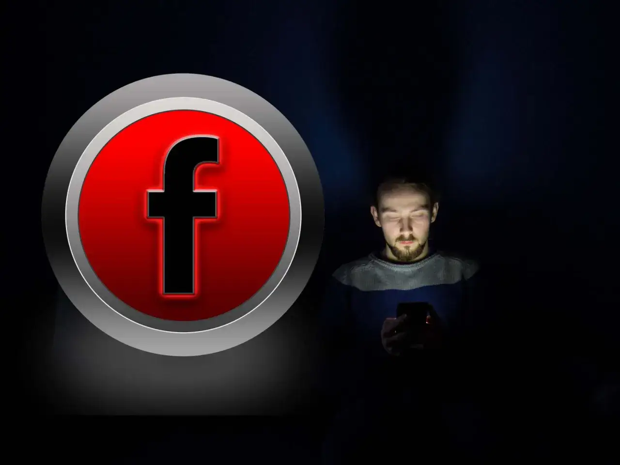 Czerwone logo Facebooka obok mężczyzny wpatrzonego w ekran telefonu. Idealne zdjęcie w tle FB.